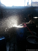 dyeing worker filling a tank with water